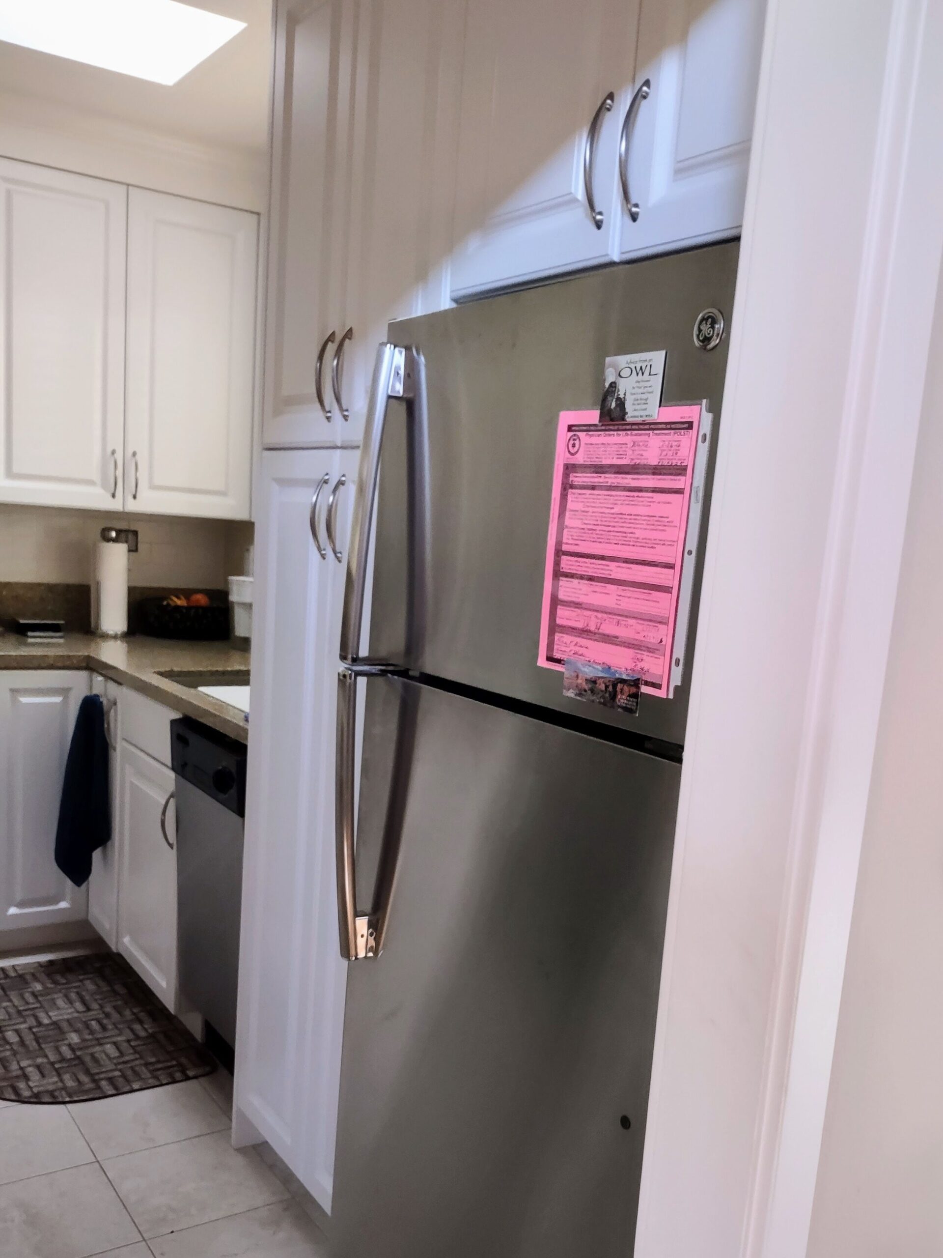 pink POLST form on kitchen refrigerator